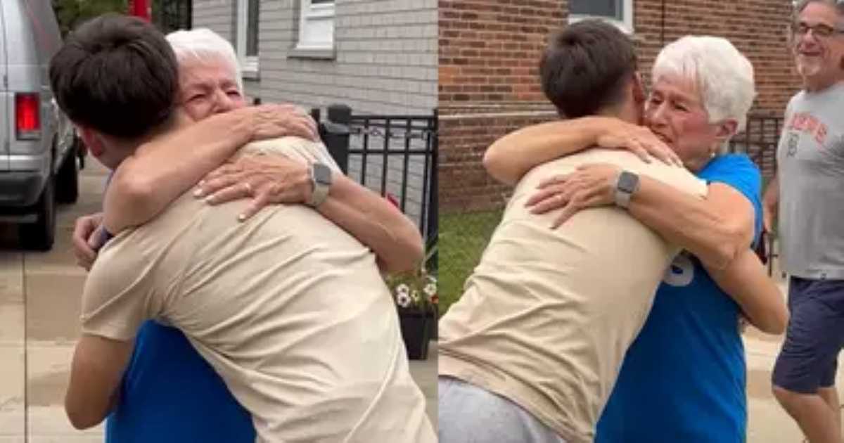 A young man embraces his emotional grandmother outside a house; both are clearly touched by the heartfelt reunion.