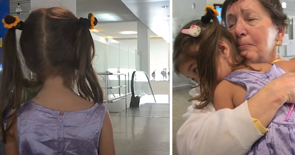 Young girl in a purple dress reunites emotionally with an older woman in an airport, sharing a heartfelt hug.