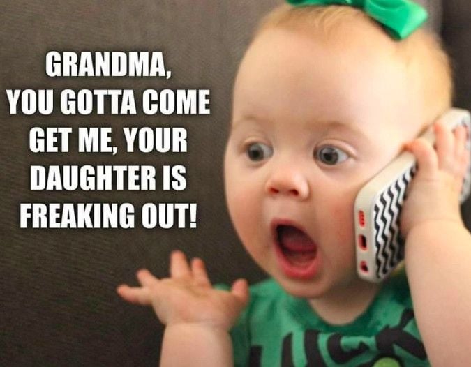 Surprised baby on the phone with text asking Grandma to help because Mom is freaking out.