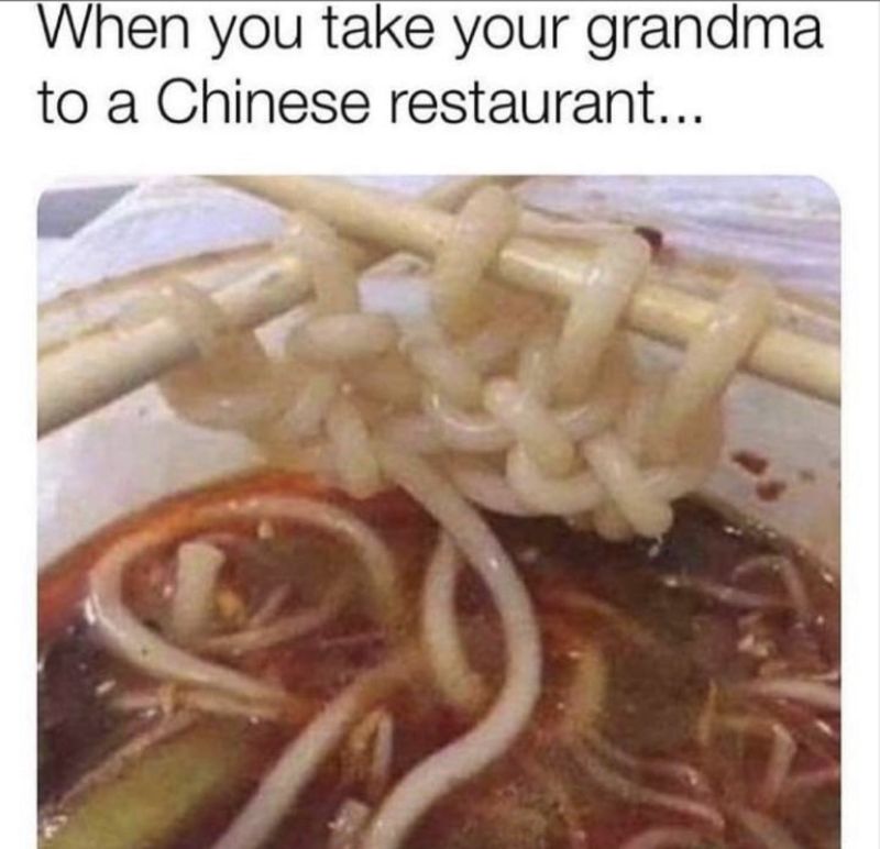Close-up of noodles tied in knots on chopsticks with text joking about taking grandma to a Chinese restaurant.