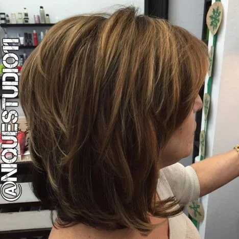 Medium Layered Hairstyle with Bangs