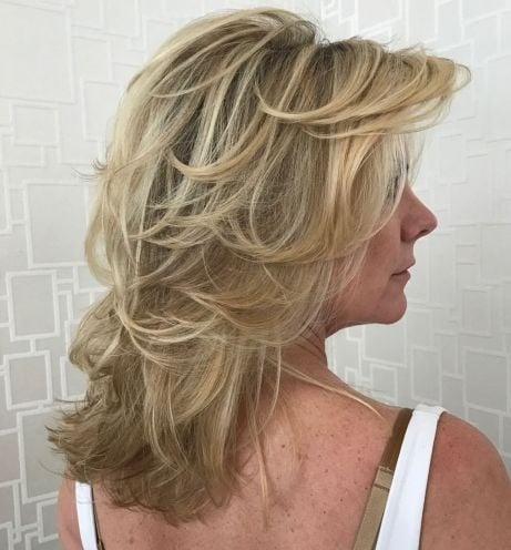 Mid-Length Feathered Beige Blonde Hairstyle