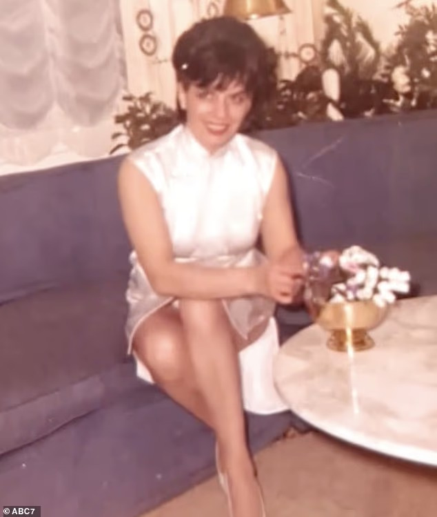 101-year-old woman who still goes to work 6 days a week shares her life advice 4 Vintage photo of a smiling young woman in a white dress, sitting on a couch next to a round table with a flower arrangement.