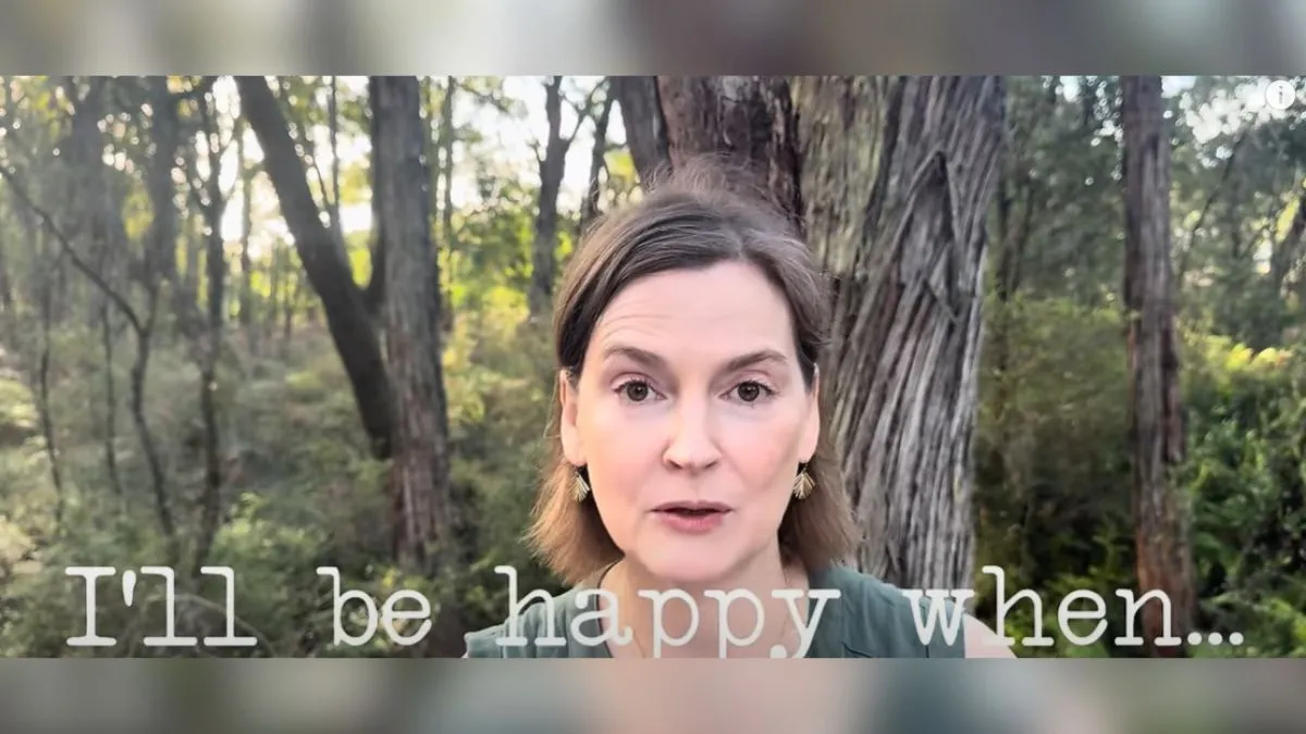 Image Alt Text Generator said: Woman standing in a forest with text overlay that reads "I'll be happy when..." suggesting a reflection on delayed happiness or mindset shifts.
