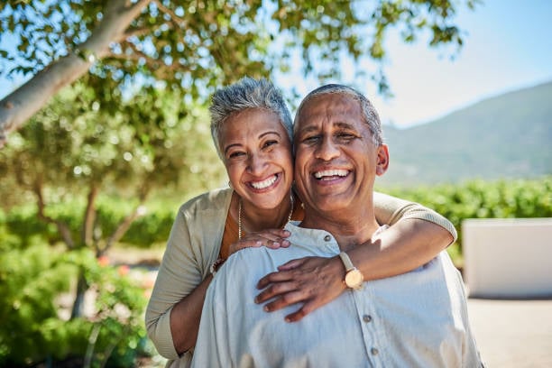 If you've achieved these 5 things by 60, you've lived a more meaningful life than most people ever will 3 Senior couple, smile and outdoor in nature park showing love, care and happy on a retirement holiday on summer day. Portrait of elderly man and woman together for fresh air and tree view on vacation